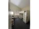 Bright bedroom showcasing a loft bed with a built-in desk, ample space for activities and relaxation at 837 Holly Lake Way, Henderson, NV 89002