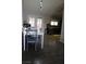 Bright dining area with hardwood floors, white table and chair set, and views to the backyard patio at 837 Holly Lake Way, Henderson, NV 89002
