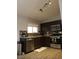 A stylish kitchen features wooden cabinets and stainless steel appliances at 837 Holly Lake Way, Henderson, NV 89002