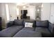 This shows a stylish living room with a comfortable sectional sofa, perfect for relaxation at 837 Holly Lake Way, Henderson, NV 89002
