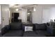 Comfortable living room featuring neutral walls and a cozy couch at 837 Holly Lake Way, Henderson, NV 89002