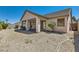 Low maintenance backyard with a covered patio and rock landscaping offers a serene outdoor space at 89 Autumn Day St, Henderson, NV 89012