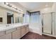 Bathroom features double sinks, tub, shower and natural light at 89 Autumn Day St, Henderson, NV 89012