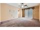 Spacious bedroom with carpet, ceiling fan, and natural light from sliding glass door at 89 Autumn Day St, Henderson, NV 89012