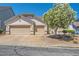 Charming single-story home features a two-car garage and a well-maintained front yard with mature landscaping at 89 Autumn Day St, Henderson, NV 89012