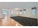Spacious living room with carpet, windows and flows into kitchen area at 89 Autumn Day St, Henderson, NV 89012