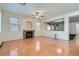 Bright living room area with a fireplace and many windows that provide natural light at 89 Autumn Day St, Henderson, NV 89012