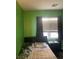 Bright bedroom with green walls, perfect for a room or office at 8913 Cambridge Glen Ct, Las Vegas, NV 89149