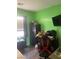Bright bedroom with green walls, perfect for a room or office at 8913 Cambridge Glen Ct, Las Vegas, NV 89149