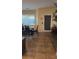 Dining Area with a table and tiled flooring with a backyard facing door at 8913 Cambridge Glen Ct, Las Vegas, NV 89149