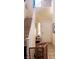 Entryway with tiled flooring, a staircase, a safety gate, and a white door at 8913 Cambridge Glen Ct, Las Vegas, NV 89149