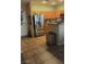 View of the stainless steel refrigerator and neutral toned cabinetry in the kitchen at 8913 Cambridge Glen Ct, Las Vegas, NV 89149