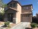 Two-story house with a well-maintained front yard and attached garage at 8982 Leaping Pad Ct, Las Vegas, NV 89148