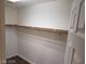 A simple walk-in closet with a hanging bar at 8982 Leaping Pad Ct, Las Vegas, NV 89148