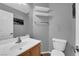 Neutral half bathroom with floating shelves and updated sink at 9082 Amanda Creek Ct, Las Vegas, NV 89149