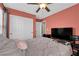 This cozy bedroom features a double bed, closet, and a ceiling fan for added comfort at 9082 Amanda Creek Ct, Las Vegas, NV 89149
