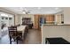 Cozy dining area and kitchen with hardwood floors and stainless steel appliances at 9082 Amanda Creek Ct, Las Vegas, NV 89149