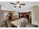 Open layout kitchen featuring wooden floors and stainless steel appliances at 9082 Amanda Creek Ct, Las Vegas, NV 89149