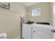 Laundry room with washer, dryer, and shelving at 9082 Amanda Creek Ct, Las Vegas, NV 89149