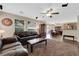 Spacious living room with hardwood floors, plush seating, and ample natural light at 9082 Amanda Creek Ct, Las Vegas, NV 89149