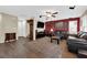 Spacious living room with hardwood floors, plush seating, and ample natural light at 9082 Amanda Creek Ct, Las Vegas, NV 89149