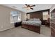 Spacious primary bedroom with decorative lamps, large bed, and natural light at 9082 Amanda Creek Ct, Las Vegas, NV 89149