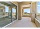 View of the outdoor balcony featuring stucco walls and a wrought iron railing, with views of the golf course at 9125 Las Manaitas Ave # 302, Las Vegas, NV 89144