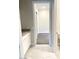 Bathroom with light tile flooring leading to a carpeted bedroom at 9125 Las Manaitas Ave # 302, Las Vegas, NV 89144
