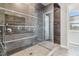 Modern bathroom featuring a glass-enclosed shower with designer tile, creating a spa-like experience at 9125 Las Manaitas Ave # 302, Las Vegas, NV 89144