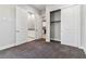Modern bedroom features grey carpet, closet, and adjacent bathroom with white cabinets at 9125 Las Manaitas Ave # 302, Las Vegas, NV 89144