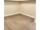 Spacious walk-in closet with neutral carpeting and convenient clothing rod and shelving at 9125 Las Manaitas Ave # 302, Las Vegas, NV 89144