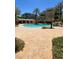 Beautiful pool area featuring a rock waterfall, palm trees, and multiple condos in a resort style residential area at 9125 Las Manaitas Ave # 302, Las Vegas, NV 89144