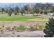 Picturesque golf course view, showcasing the meticulously landscaped greens, desert vegetation, and distant city skyline at 9125 Las Manaitas Ave # 302, Las Vegas, NV 89144