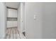 Hallway with built-in cabinets and drawers for storage, paired with wood-look flooring at 9125 Las Manaitas Ave # 302, Las Vegas, NV 89144