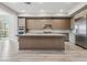 Modern kitchen featuring a large island, stainless steel appliances, and sleek cabinetry at 9125 Las Manaitas Ave # 302, Las Vegas, NV 89144