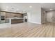 Open concept kitchen featuring modern cabinets, stainless steel appliances and hardwood floors at 9125 Las Manaitas Ave # 302, Las Vegas, NV 89144