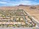 Wide shot of the community with well-maintained homes, landscaping, street, and desert scenery in the backdrop at 9362 Wilderness Glen Ave, Las Vegas, NV 89178