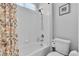 Bathroom featuring a shower/tub combination with white tile and a butterfly curtain at 9362 Wilderness Glen Ave, Las Vegas, NV 89178