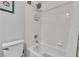 Clean and bright bathroom with a white tiled shower and toilet at 9362 Wilderness Glen Ave, Las Vegas, NV 89178