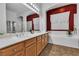 The bathroom features double sinks, a soaking tub, and separate shower at 9362 Wilderness Glen Ave, Las Vegas, NV 89178