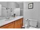 Bathroom features a double sink vanity with a large mirror and a separate toilet area at 9362 Wilderness Glen Ave, Las Vegas, NV 89178