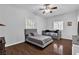 This bedroom offers a bed, a daybed, ceiling fan, and wood floors at 9362 Wilderness Glen Ave, Las Vegas, NV 89178