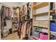 Walk-in closet features built-in shelves, drawers, and ample hanging space for clothes and accessories at 9362 Wilderness Glen Ave, Las Vegas, NV 89178
