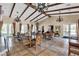 Elegant clubhouse featuring coffered ceilings, tiled floors, ornate chandeliers and comfortable seating areas at 9362 Wilderness Glen Ave, Las Vegas, NV 89178