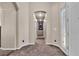 Inviting hallway with neutral tones, offering a seamless transition between different areas of the home at 9362 Wilderness Glen Ave, Las Vegas, NV 89178