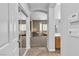 Hallway with a view to the bathroom, main living area, closet, and neutral color scheme at 9362 Wilderness Glen Ave, Las Vegas, NV 89178