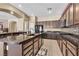 Modern kitchen with granite countertops, stainless steel appliances, and stylish backsplash at 9362 Wilderness Glen Ave, Las Vegas, NV 89178