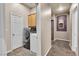 Functional laundry room with modern washer and dryer, cabinet storage, and convenient access at 9362 Wilderness Glen Ave, Las Vegas, NV 89178