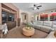 Spacious living room with a plush sofa and open layout, great for entertaining guests at 9362 Wilderness Glen Ave, Las Vegas, NV 89178