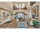Lobby with high ceilings, elegant decor, and comfortable seating, creating a welcoming space for residents and guests at 9362 Wilderness Glen Ave, Las Vegas, NV 89178
